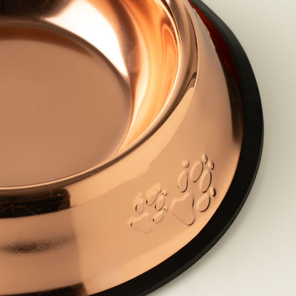 Shiny copper-colored pet food bowl with paw print design and non-slip base.